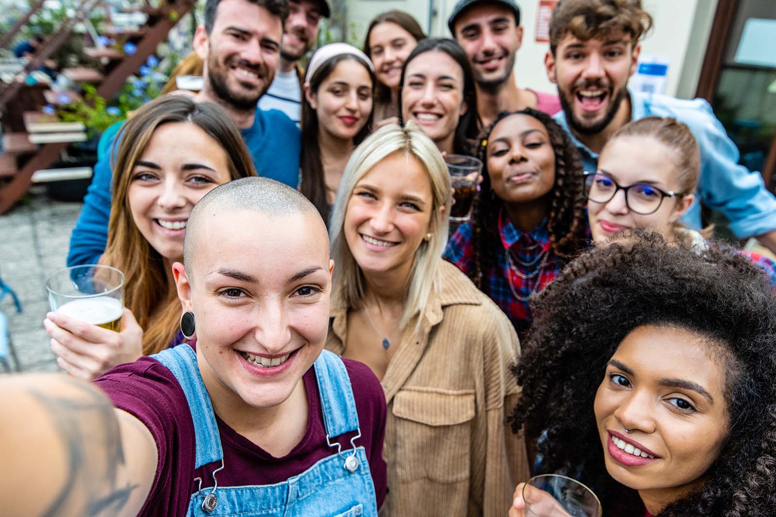 Photo of a group of friends smiling for a selfie.