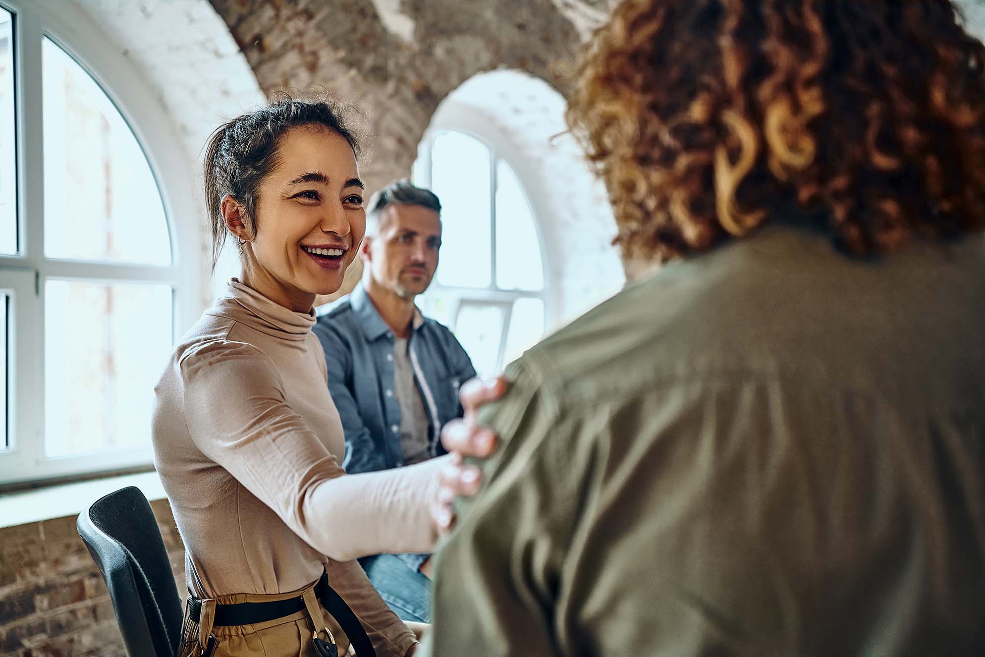 Photo of three people in a meeting